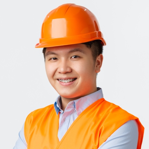 Building sector and industrial workers concept. Confident young asian engineer, construction manager in reflective clothes and helmet, cross arms and smiling sassy, ensuring quality, white background.